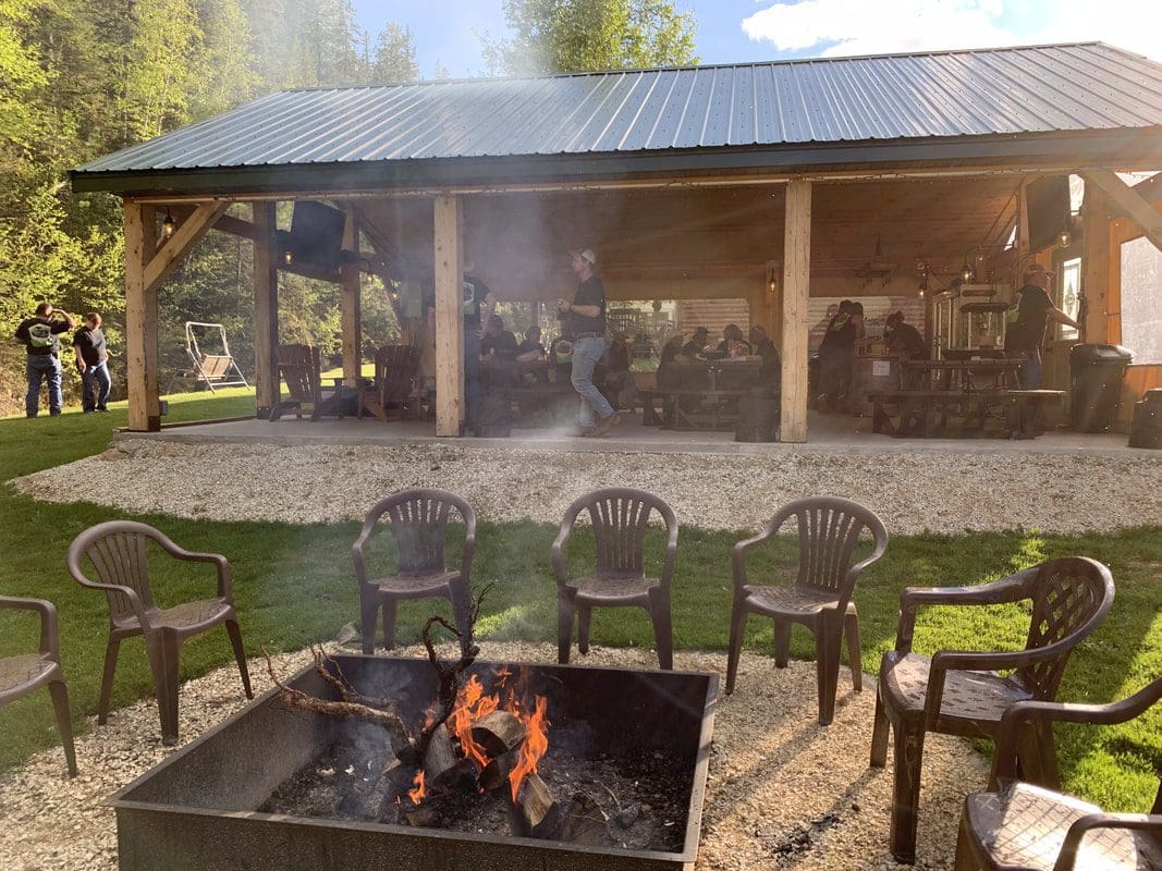 Exterior view of the fire pit and Buck Snort Beer Patio creekside pavillion